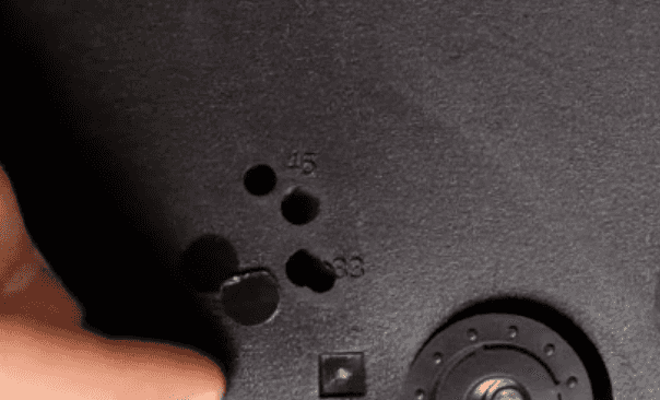 Close up of adjustment holes on bottom